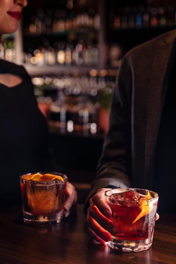 Next Hotel Melbourne, Curio Collection By Hilton Exteriör bild A bartender at work